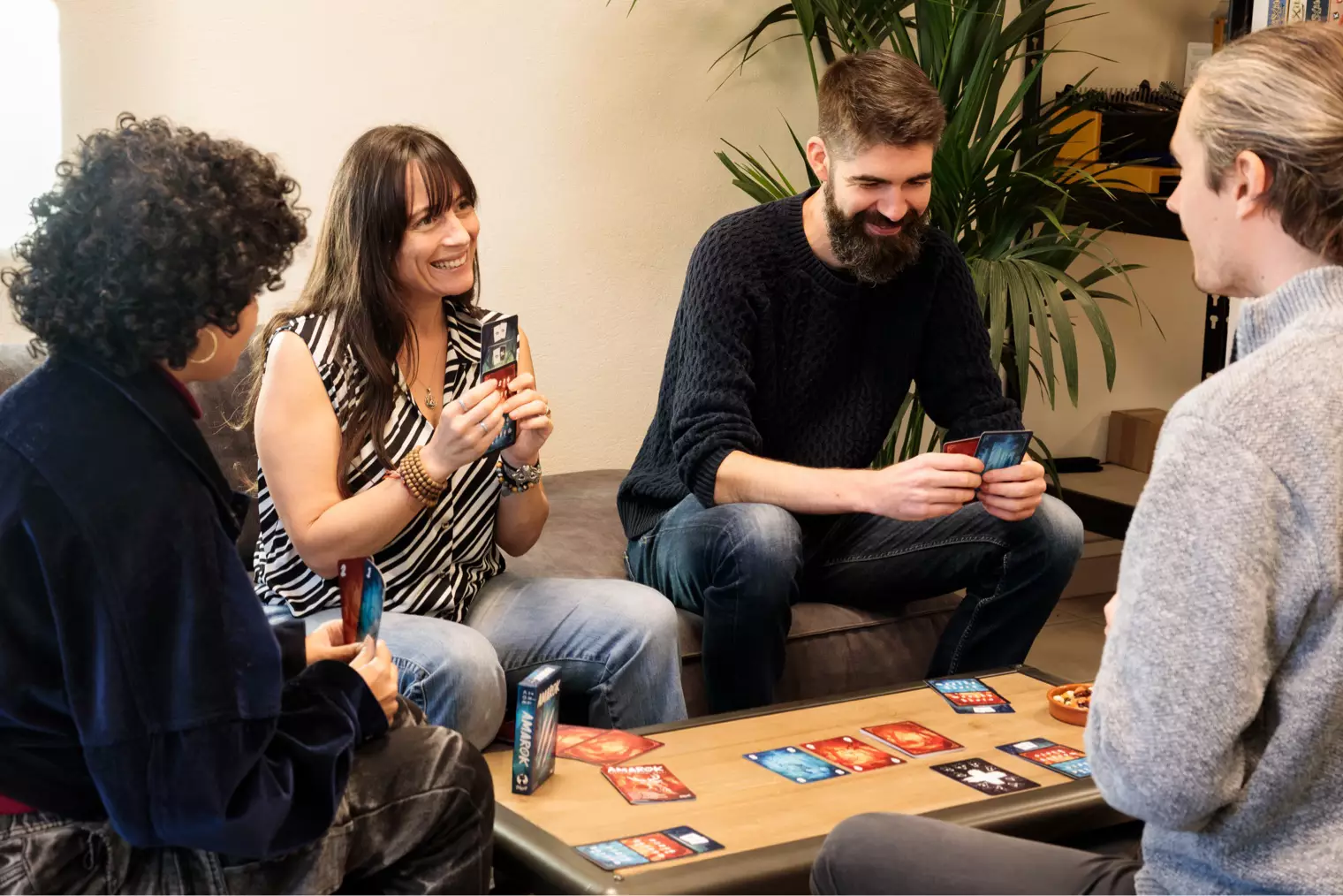 Camille, Charlène, Yoann, and Ange deep into a game of Amarok